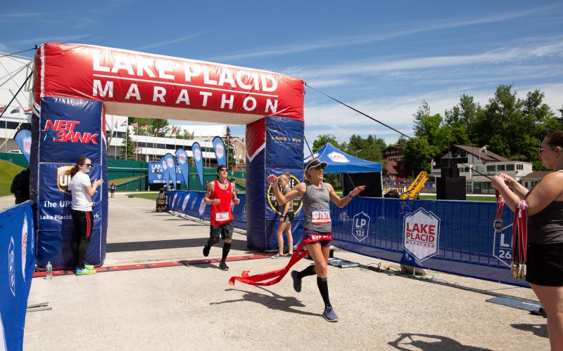 Runner crosses the finish line of the Lake Placid Marathon