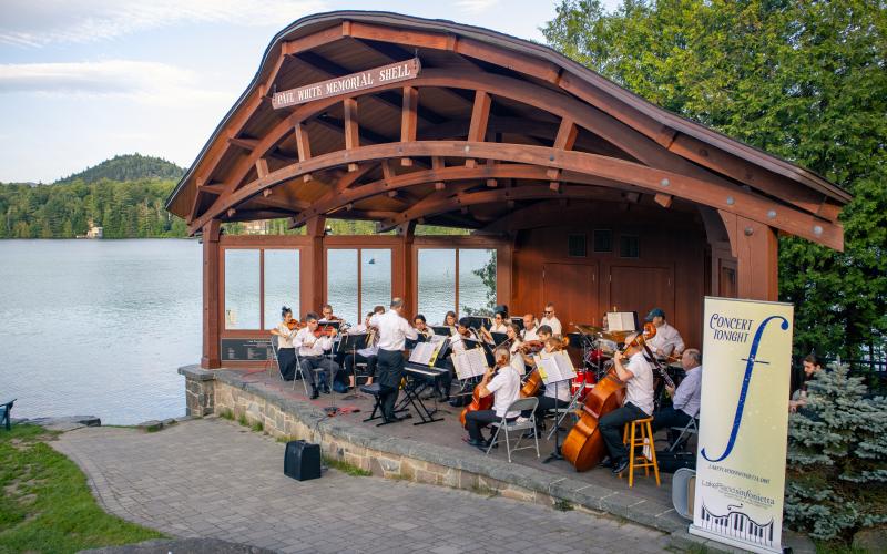 Orchestra in the park shell with Mirror Lake background Credit to: Jacob Rushlow