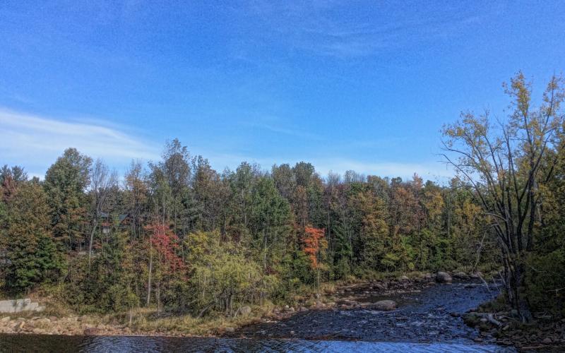 Leave the dam and see the river follow the road.