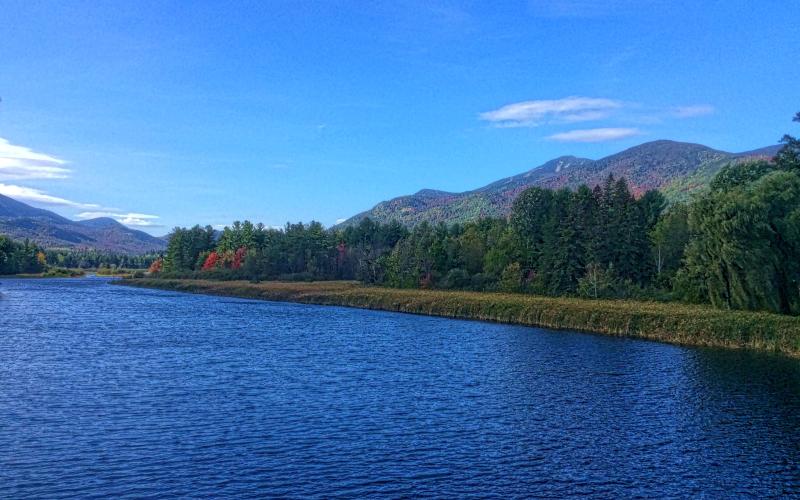 The blue of the sky matches the blue of the lake in the Adirondacks.