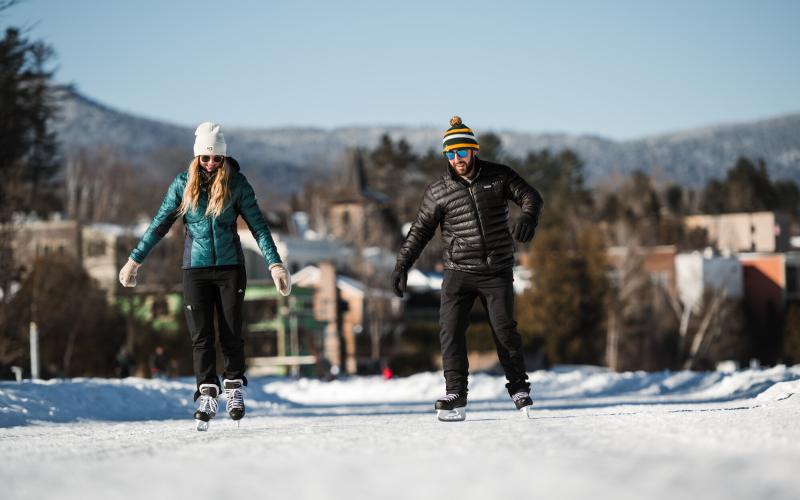 Couple skating on frozen lake