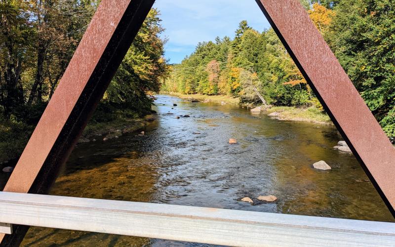 The view of a river from a metal bridge