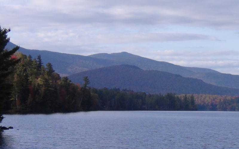 The scenery includes a mountain range.
