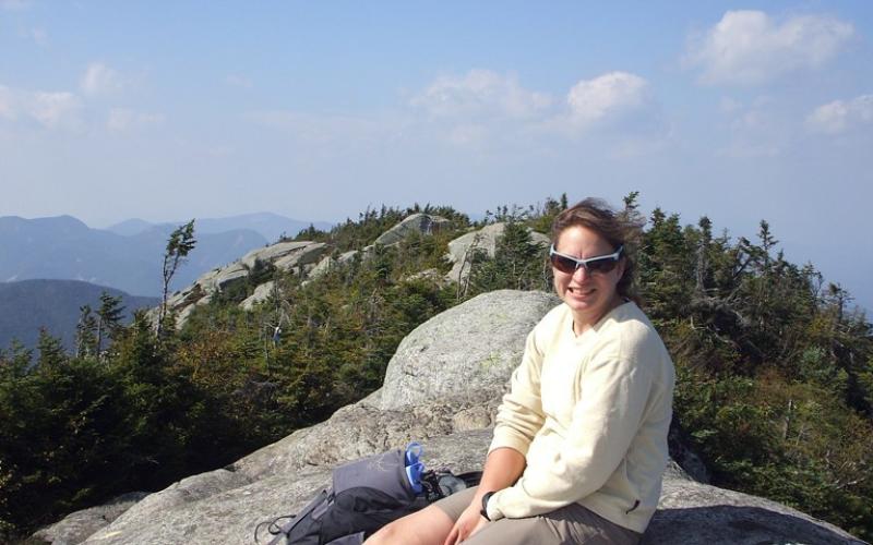 Celebrating the summit of Dix Mountain on a summer day.
