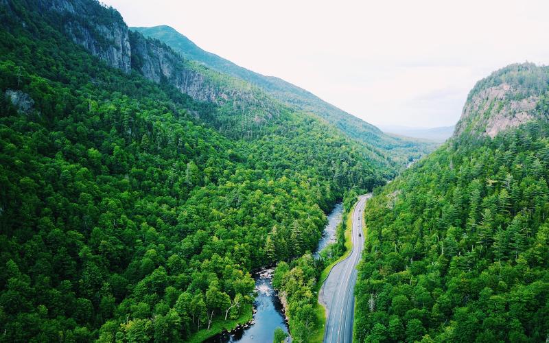 An aerial view of a road winding through a mountain pass.