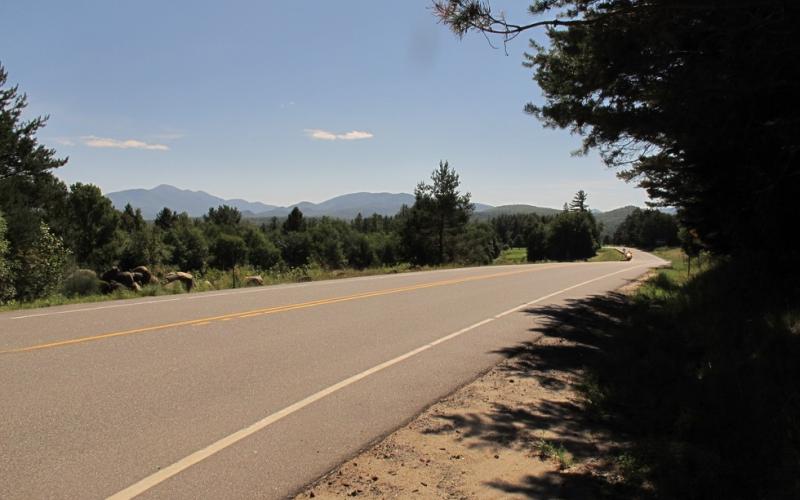 A road by a winding river